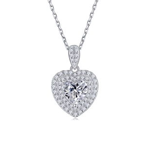 Macro shot of silver heart-shaped pendant with sparkling pavé moissanite stones