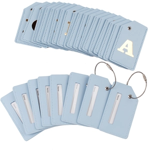 Detail of light blue PU leather luggage tags with letter A and steel wire cable