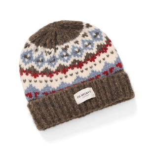 Close-up of Fair Isle knit pattern with ribbed brown brim and brand label on beanie