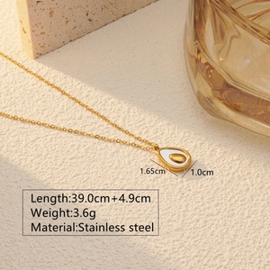 Detail showing dimensions and material of the golden stainless steel avocado necklace