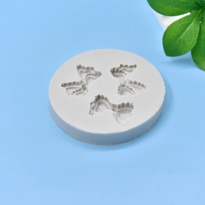 Round silicone mold with three bow tie cavities for fondant cake baking and DIY crafts