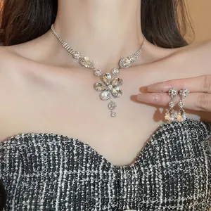 Sparkling diamond flower and teardrop pendant necklace and earrings set for women