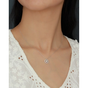Model wearing a delicate S925 silver necklace with opal pendant and zircon starburst detail