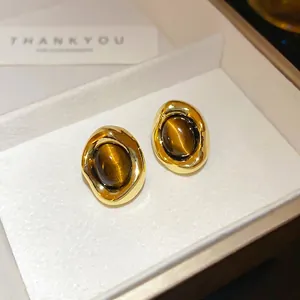 Retro gold-plated tiger eye stone earrings displayed in an elegant jewelry gift box