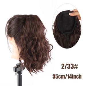 Detail view of 14-inch water wave ponytail extension with mesh net and clips