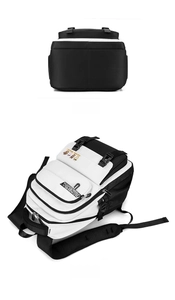 Detail view of large capacity black and white backpack with bottom and side perspectives