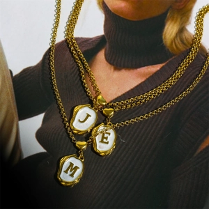 Layered 18K gold-plated twisted chains with heart and letter J, E, M shell pendants