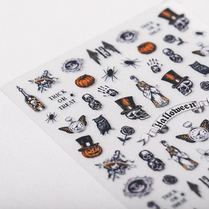Halloween nail stickers featuring skulls and pumpkins with a vintage hand-drawn illustration style
