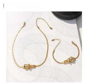 Golden titanium steel snake chain set with a unique belt buckle pendant and adjustable clasp