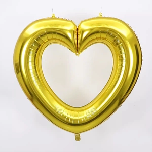 Detail of 40-inch hollow heart-shaped gold foil balloon for romantic party decorations