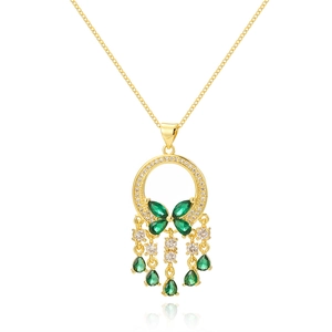 Golden necklace with emerald butterfly pendant and hanging gemstone tassels on white background