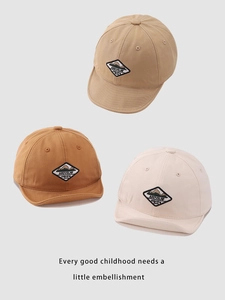 Detailed view of kids outdoor canvas baseball caps with mountain patch in three earthy colors