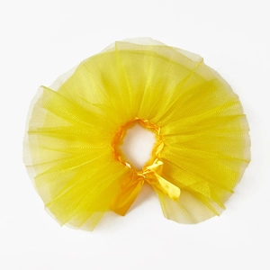 Detail of a bright yellow pet tutu skirt with multi-layer mesh and a silk bow decoration