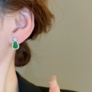 Elegant Chinese style green gourd stud earrings with zircon inlay worn by a model