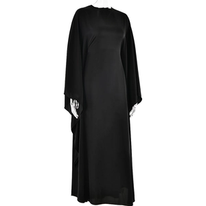 Detailed view of long black satin dress with elegant batwing sleeves and smooth fabric