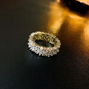 Luxurious gold plated eternity ring with micro-paved rectangular and round zircons
