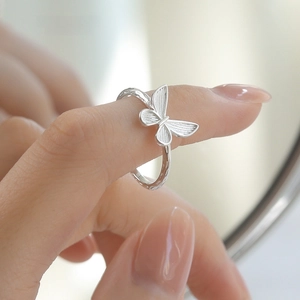 Elegant S925 sterling silver butterfly ring for women with delicate texture on a model hand
