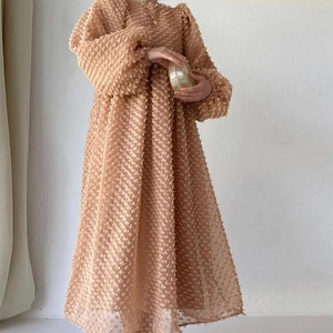 Chic apricot long sleeve dress with 3D dot texture and elegant puff sleeves