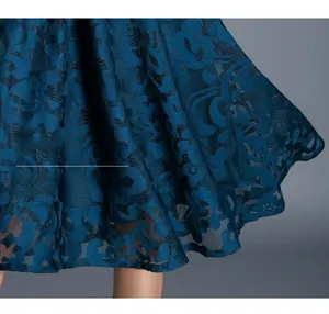 Detailed macro view of the high-waisted dark blue floral jacquard A-line skirt hem