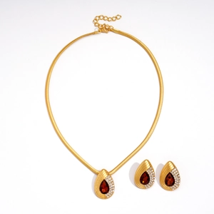 Vintage gold snake pendant necklace set with red pear-shaped crystals and white diamonds