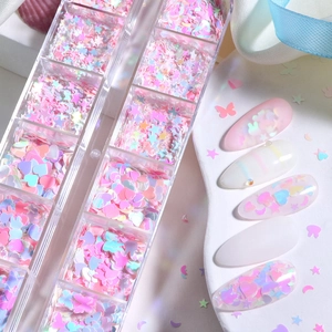 12-grid nail art glitter set featuring pastel hearts, stars, and butterflies designs