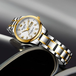 Classic silver and gold ladies quartz watch with white dial and day-date display