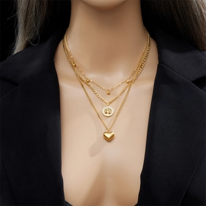 Three-layer gold titanium steel necklace with tree of life and heart pendants
