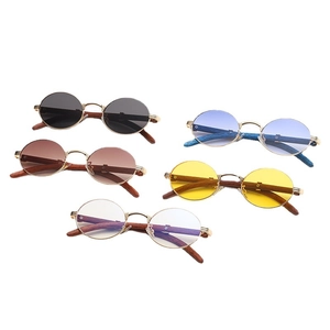 Retro round sunglasses with wood grain temples and various lens colors on display