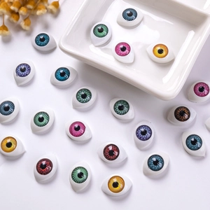 Macro shot of colorful 12x16mm acrylic doll eyes with realistic pupil texture