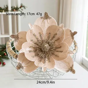 Close-up of champagne velvet Christmas magnolia with gold sequins and 24cm diameter