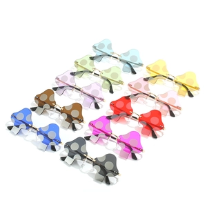 Frameless mushroom sunglasses with colorful wave lenses and stylish white polka dots