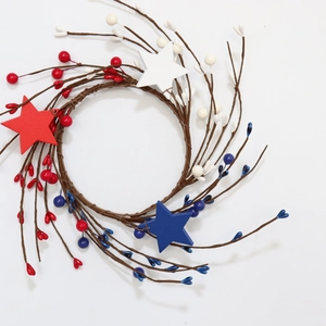 Patriotic July 4th candle ring with red white and blue stars on rustic twig wreath