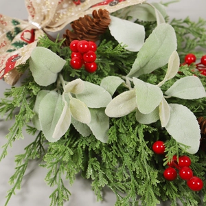 Rustic Christmas wall swag with pine cones, red berries, and vintage truck bow decoration
