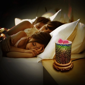 3D firework aroma lamp with melting pink wax cubes on nightstand beside sleeping family