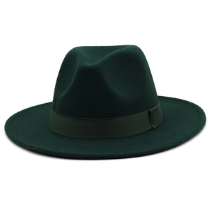 Detail view of the dark green wool felt fedora with a matching ribbon trim and wide brim