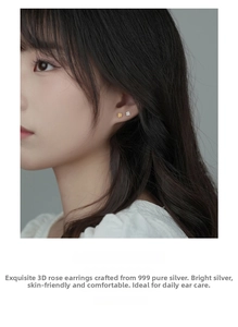 Detail of S999 sterling silver rose stud earrings in gold and silver on a model