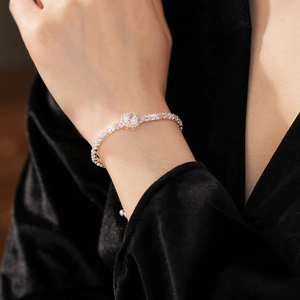 Detail of adjustable silver bracelet with sparkling pink and white cubic zirconia stones