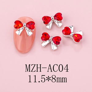Detail of red bow nail charms with zircon stones and silver metal base for DIY manicure