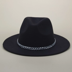 Detail of a black wool fedora hat featuring a chunky silver chain band and flat brim