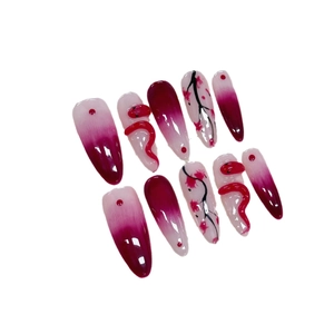 Handmade burgundy red snake press-on nails with 3D floral art and almond shape