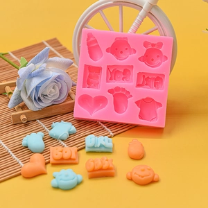 Pink silicone baby mold with bottle and heart shapes for DIY fondant or chocolate