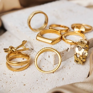 8-piece set of gold stainless steel rings with geometric and textured designs