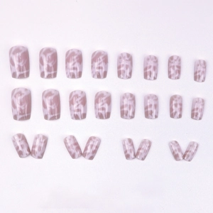 Glossy nude press-on nails with marble texture patterns and short square shape