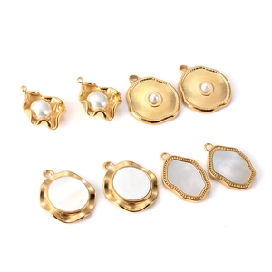 Detailed set of gold stainless steel pendants featuring white pearl and shell inlays