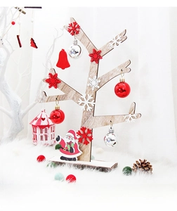 Detail of wooden Christmas tree frame with festive red and white hanging ornaments