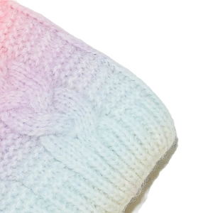 Detail of colorful tie-dye cable knit pattern on children winter hat and glove set