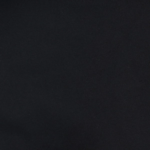 Gros plan sur la texture du tissu en maille noire montrant le tissage détaillé des fibres