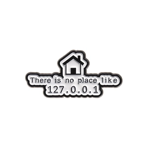 Geek-style enamel pin featuring 'There is no place like 127.0.0.1' text on white background