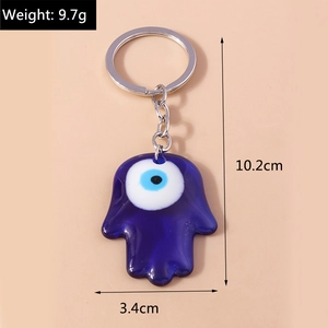 Detail view of Hamsa hand keychain with evil eye showing size dimensions and weight