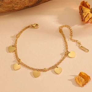 Golden double-layer stainless steel bracelet featuring five polished heart pendants